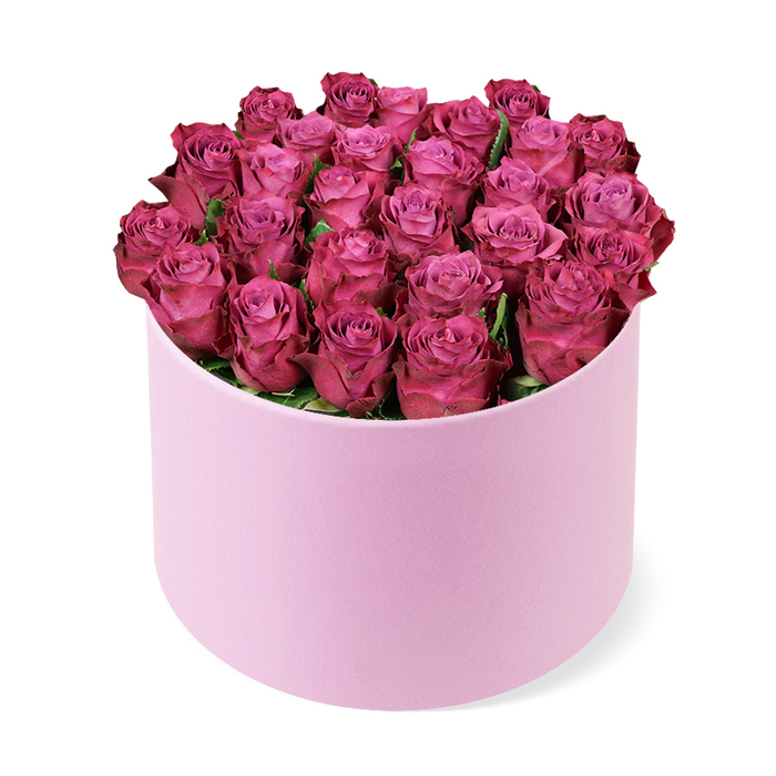 A visually striking, luxurious floral arrangement features dozens of tightly packed, vibrant deep pink or fuchsia roses, arranged in an elegant, round, light pink box with a subtle matte or velvet-like texture. The roses are meticulously arranged to form a lush, domed bouquet that completely fills the opening of the cylindrical box, showcasing their tightly curled petals in various stages of early bloom. Hints of dark green foliage peek out occasionally between the dense cluster of rose heads, adding depth without stealing attention from the color. The soft pink of the container beautifully complements the jewel-toned flowers, creating a striking contrast. The box stands upright on a clean, bright white background, casting a gentle shadow beneath it and emphasizing its three-dimensional form and the exquisite details of this sophisticated floral gift.
This image conveys themes of beauty, romance, celebration, and luxury, making it ideal for articles on gifting, special occasion flowers (Valentine's Day, anniversaries, birthdays, or Mother's Day), premium floral delivery services, or elegant home decor.
Viewed from the same elevated angle, the dome appears to cradle the petals as if it were a jewel. The soft gradient of pinks, from champagne to magenta, invites the eye to travel from box to bloom, then to the clean white plane behind, where the bouquet seems to hover in a moment of quiet radiance.
For readers in East Finchley, this arrangement signals a contemporary, high-end gift that can brighten a reception desk or a holiday table, while the careful edging of the box and the restrained greenery keep the focus firmly on the roses and their glow. It would be a refined choice for same-day delivery across the area, bringing luxury straight to a doorstep with the efficiency and care you expect from a trusted local florist.