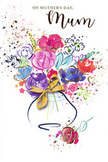 A vibrant, hand-painted bouquet fills this Mother's Day card, its watercolour petals and shimmering accents evoking the charm of a spring morning in East Finchley. Bold strokes of cerise, deep magenta, and lively pink gather at the centre of the design, each petal outlined in rich indigo that lends definition while allowing the colours to bleed softly into one another. Around these core blooms, gentle washes of apricot, peach, lilac, and soft blue expand outward, giving the impression of mixed seasonal flowers loosely arranged in an artist's vase. Thin threads and tiny dots of metallic gold trace petals and leaves, catching the light much like the reflective surfaces of vases and ribbons in a florist's shop near the High Road. The arrangement emerges from a gracefully curved, stylised vase, painted in translucent shades that keep the composition light and airy. A fine golden bow sits tied at the vase's neck, echoing the careful finishing touches East Finchley Flowers might add before delivering a hand-tied bouquet to homes near Cherry Tree Wood, East End Road, or the quiet cul-de-sacs beyond. Speckles of paint and scattered heart motifs float around the bouquet on a crisp white background, suggesting a sense of celebration, gratitude, and affectionate energy swirling in the air. The overall feel is joyful yet comforting-a visual expression of thankfulness and love, crafted to honour the special connection between mother and child that is celebrated in homes across East Finchley on Mother's Day.